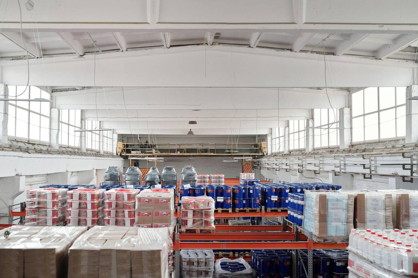 Bright e-commerce fulfillment warehouse with racking and stock