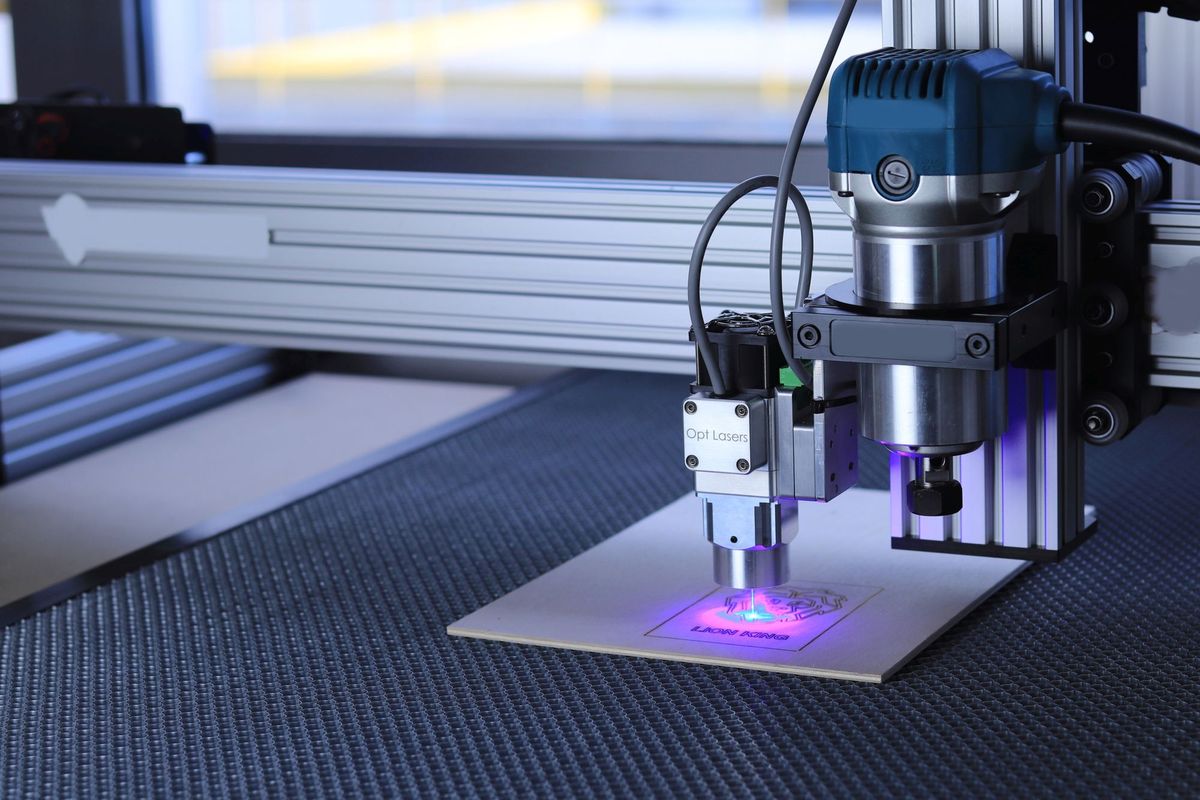 Laser engraving a metal plate with a bright laser beam, for personalised products